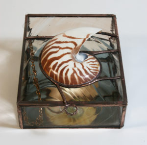 A lovely keepsake / jewelry box using a Nautilus shell as the centerpiece.