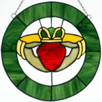 A circlular Claddagh symbolizing the hands of friendship, the heart of love and the crown of fidelity.