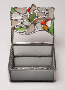 Cute little jewelry box using milk glass and beach glass with some colorful nuggets.