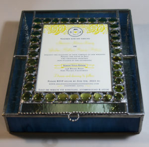 Used key colors of yellow and blue to create a keepsake box for a couple's wedding invitation.