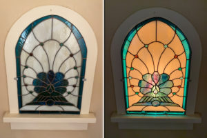 Panel designed to fit in an alcove with a backlight. The varied hues of the rippled art glass and glass nuggets sparkle with the light on.
